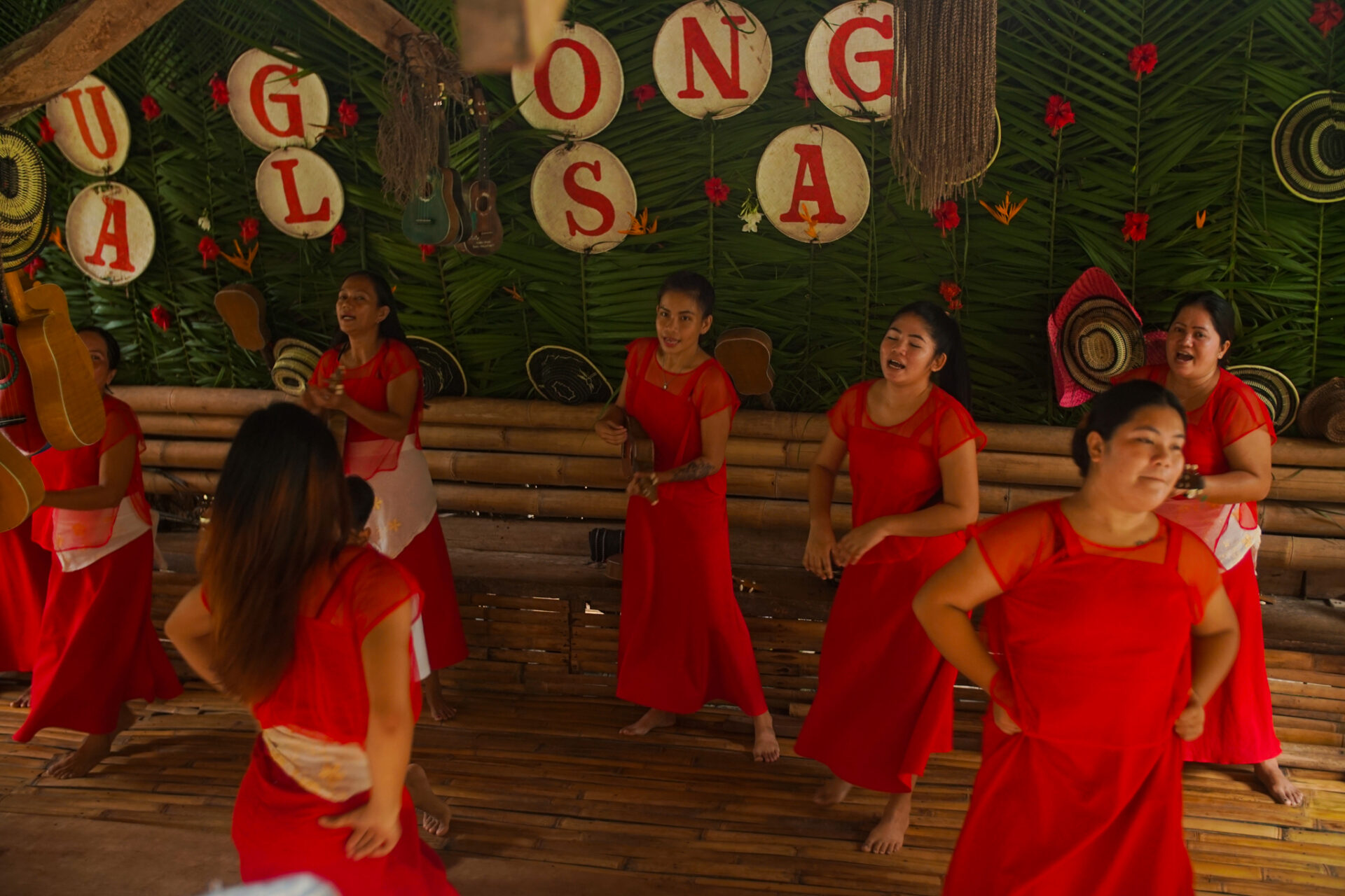 Floating restaurants cruising along the peaceful Loboc River surrounded by lush tropical landscapes in Bohol.