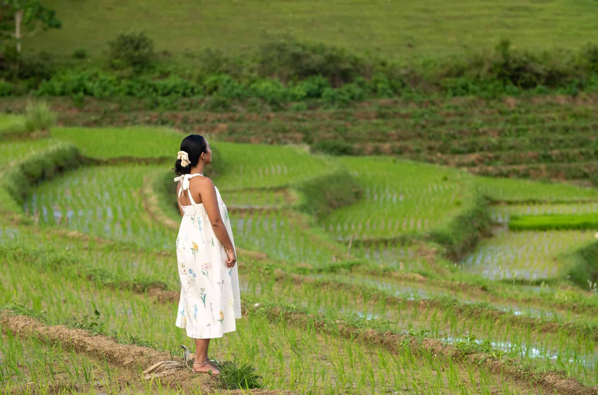 Traveler overlooking the scenic Cadapdapan Rice Terraces in Candijay, Bohol Island Geopark, Philippines.