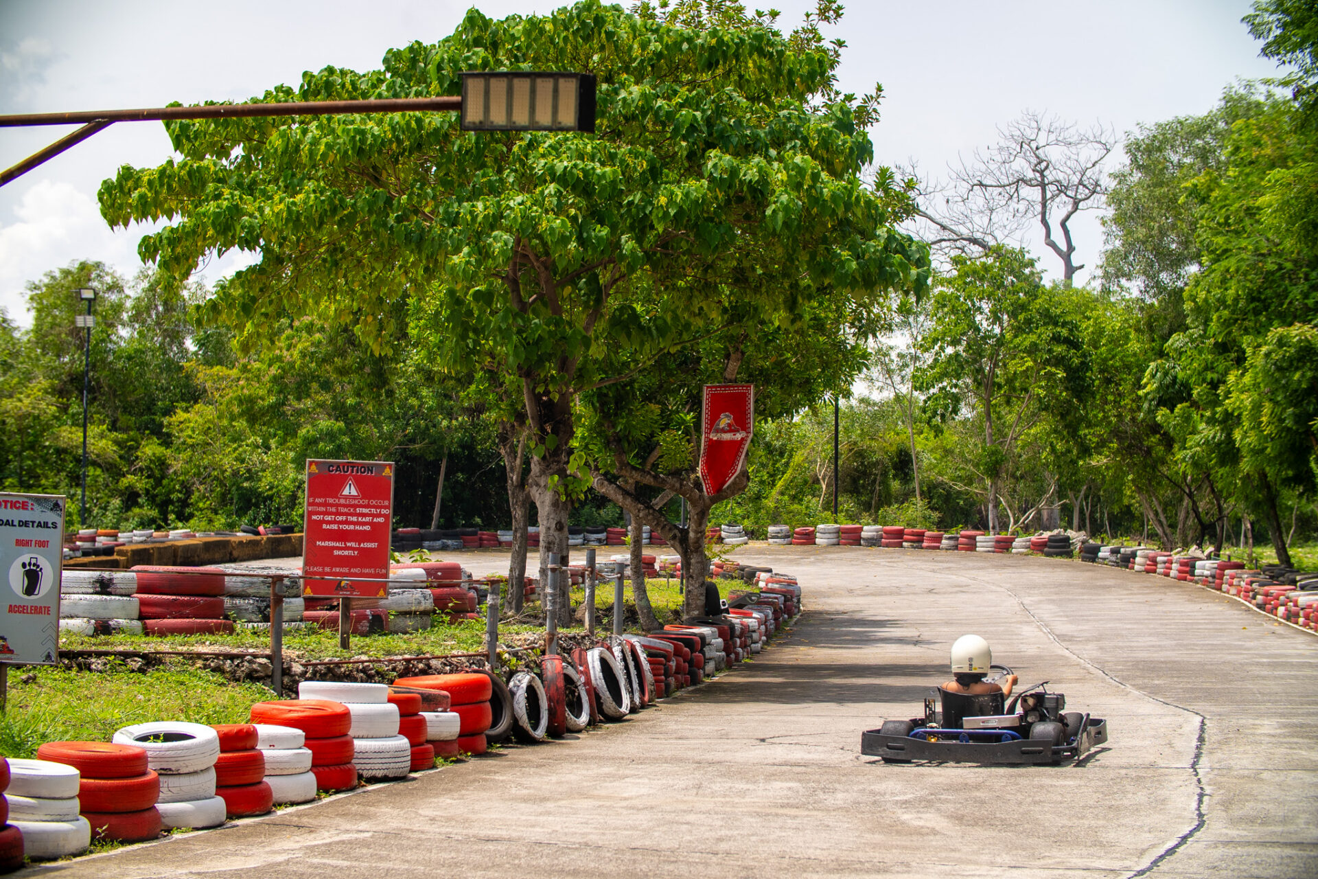 Outdoor go-kart racing track at Panglao Kartways surrounded by lush tropical scenery in Panglao, Bohol.